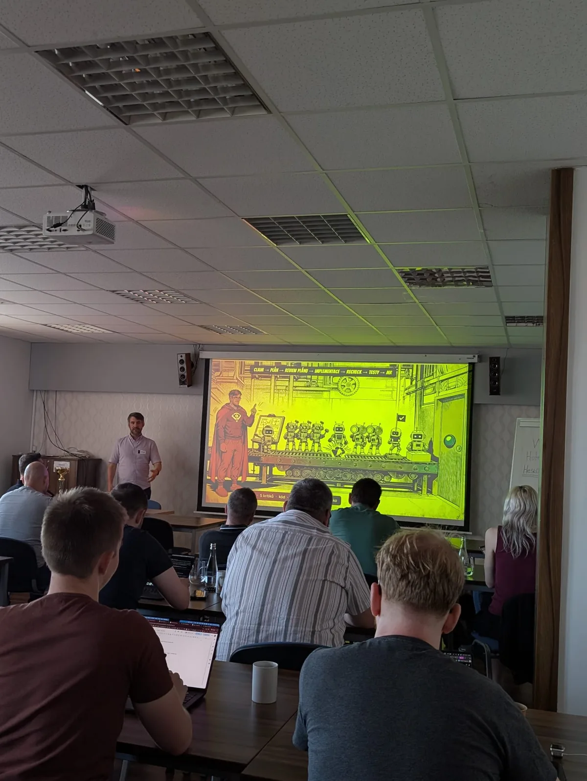 Slide s celým řetězcem claim, plán, review plánu, implementace, recheck, testy a merge request na AI BOOTCAMPu